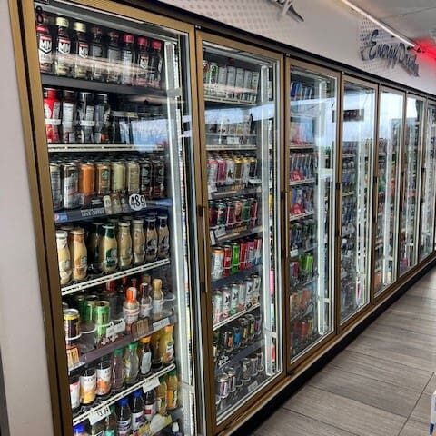 A large display case filled with lots of drinks.