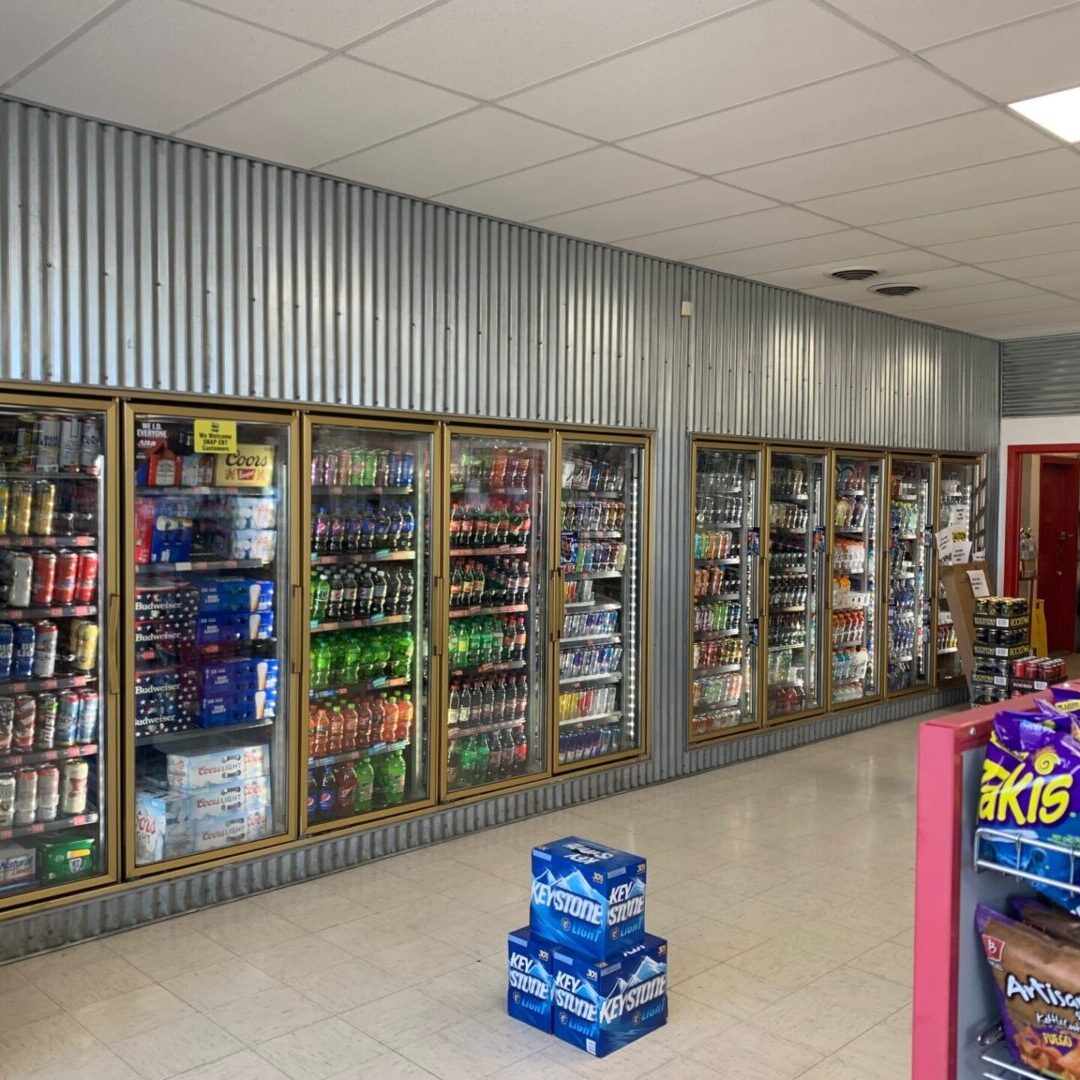 A store with many shelves of beverages and drinks.