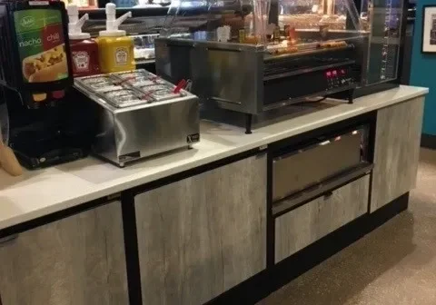 A restaurant kitchen with many different types of food.