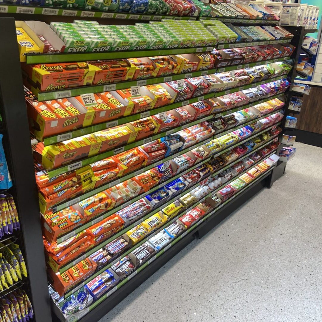 A display case filled with lots of different types of snacks.