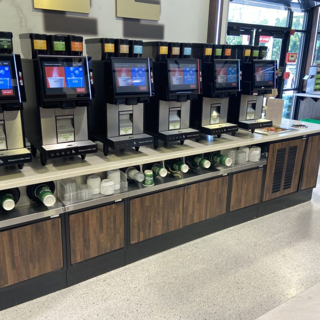 A row of machines that are sitting on the counter.