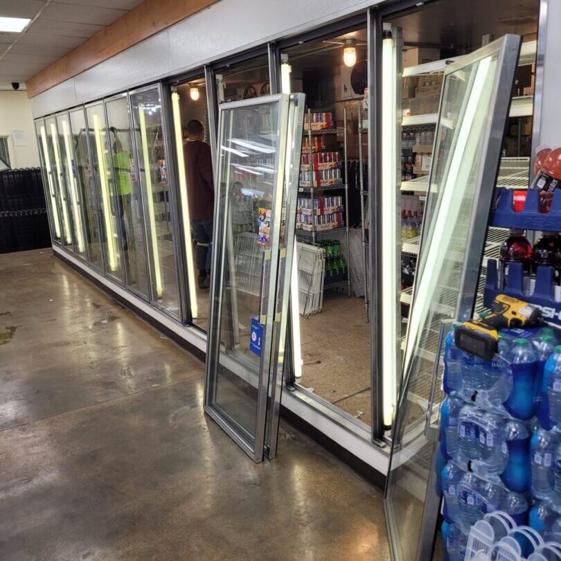 A store with many glass doors and shelves